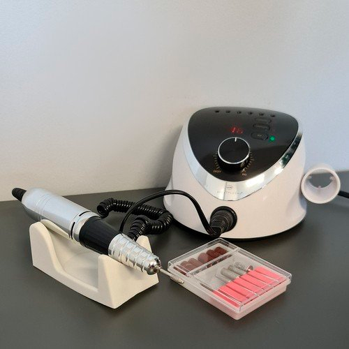 Manicure and pedicure machine with cutters, foot pedal