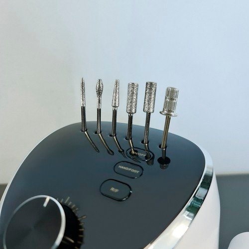 Manicure and pedicure machine with cutters, foot pedal