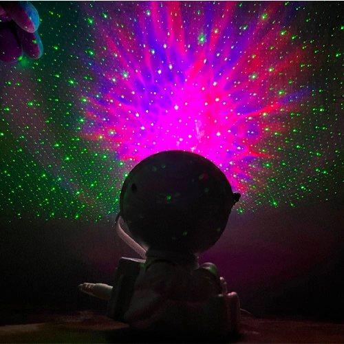 Projector astronaut with remote control - projection of the starry sky, galaxy, space