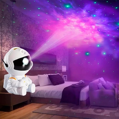 Projector astronaut with remote control - projection of the starry sky, galaxy, space